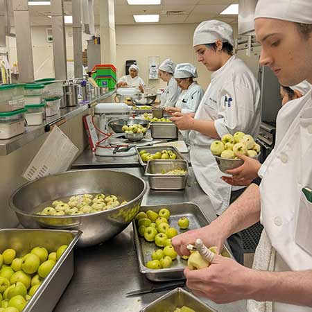students processing apples